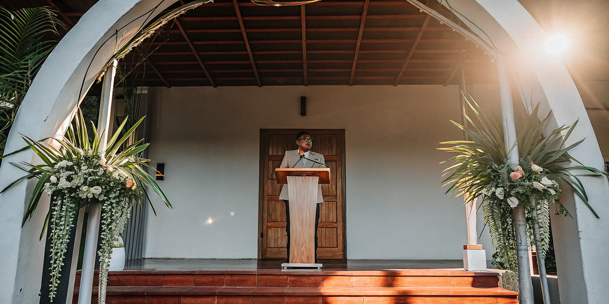 Wedding officiant at ceremony podium.