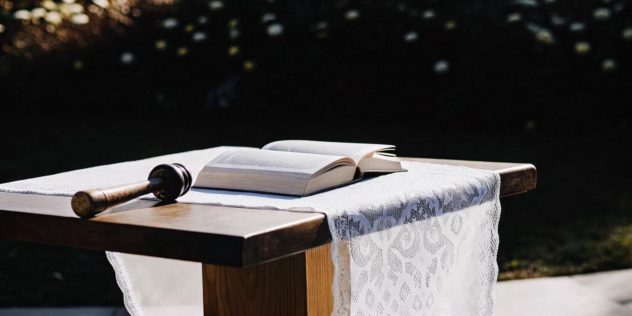 Wedding officiant's guide: Book, gavel, and lace.